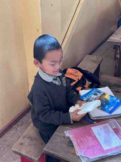 A Nepalese child holds his gift. 