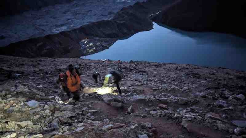 Journeying to the summit in the early morning darkness.