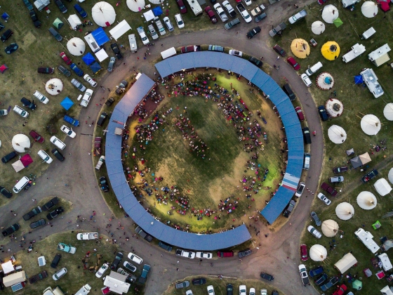 Powwow grand entry from the planner's view: Amskapi Piikuni, Niitsitapi Territories 2017 by Christopher Carter MSU Native Land Project