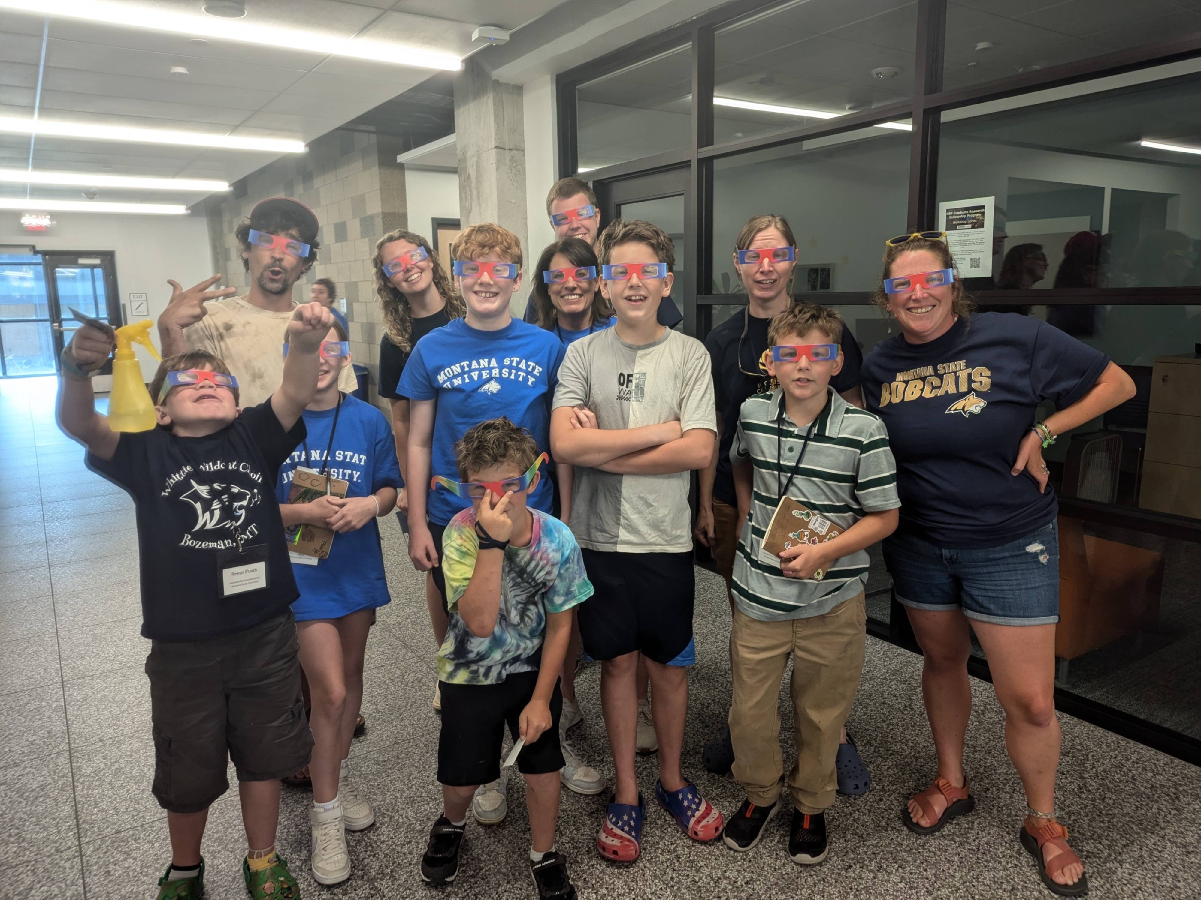 Students and teachers at the Inclusive Community Camp Camp pose for a photo while wearing a type of 3D glasses